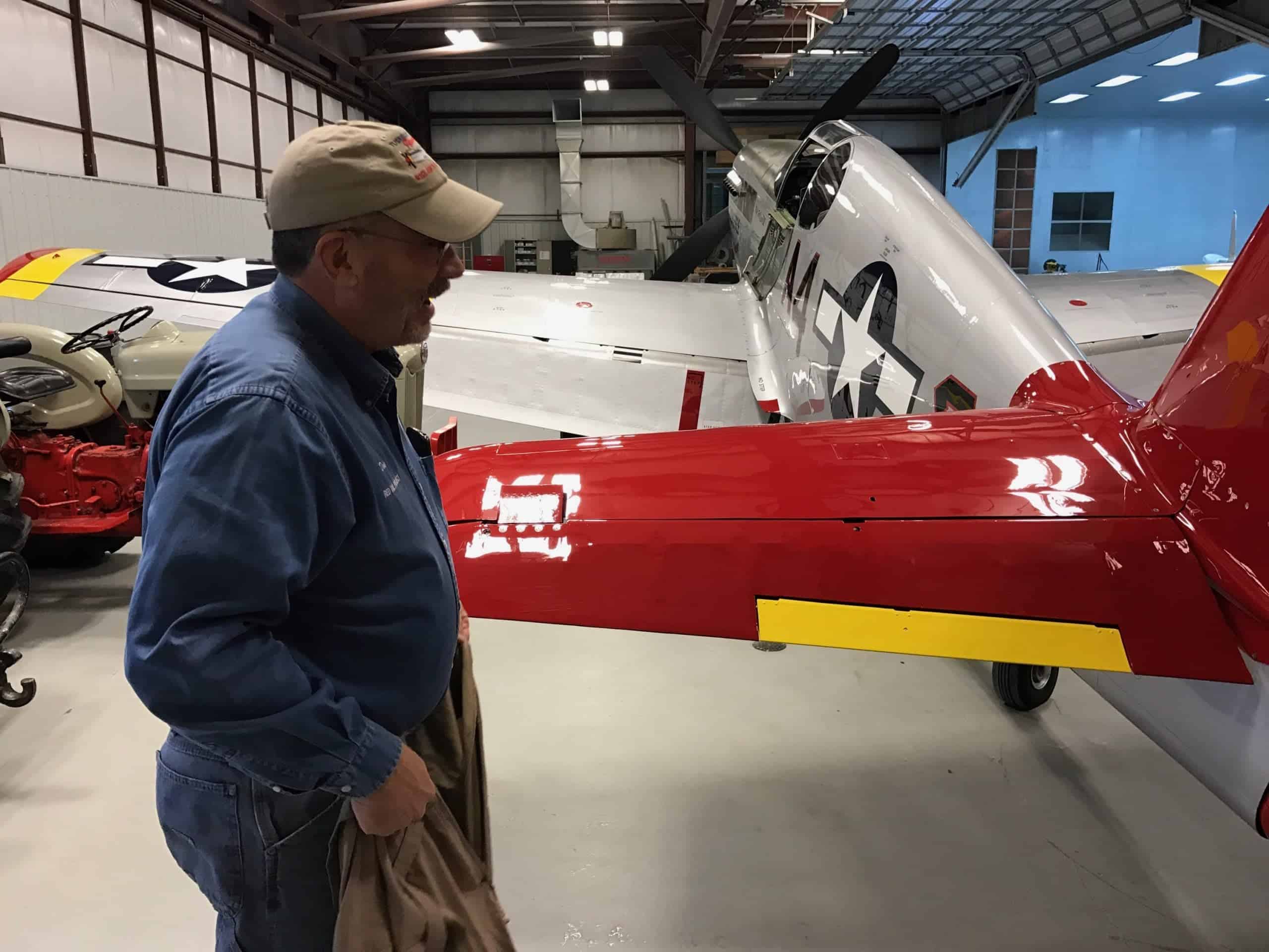 Pilot Doug Rozendaal makes one last inspection of the P-51C Mustang "Tuskegee Airmen" today before taking final delivery of the aircraft.