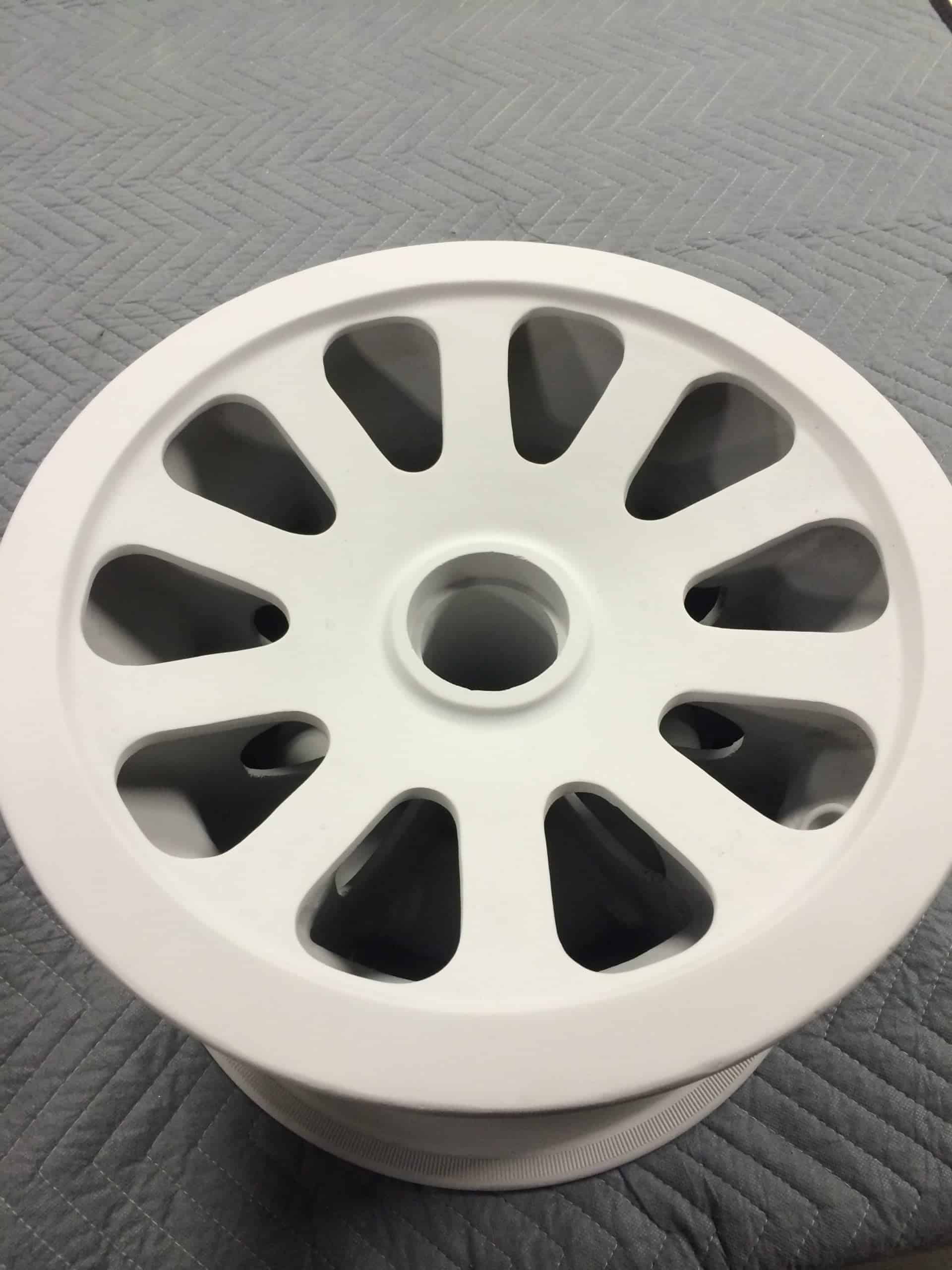 An overhauled wheel after Tagnite coating has been applied and ready for paint.